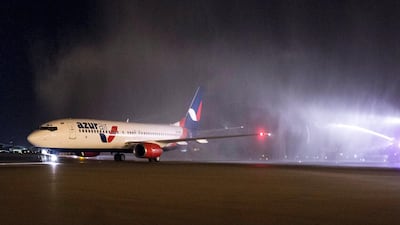 The first charter flight from Azur Air Lands in Abu Dhabi from Moscow to a water-cannon salute. Courtesy Abu Dhabi Culture and Tourism