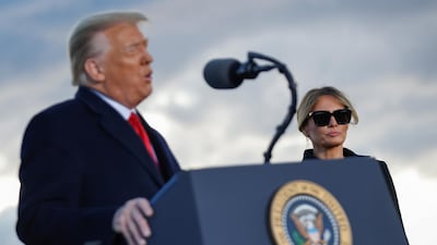 First lady Melania Trump looks on as US President Donald Trump speaks at the Joint Base Andrews, Maryland. Reuters