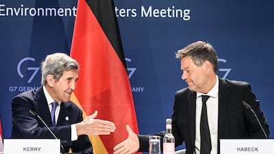 US climate envoy John Kerry and German Vice Chancellor Robert Habeck shake hands at the G7 talks in Berlin. EPA