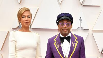 Tonya Lewis Lee and Spike Lee, wearing Gucci in a tribute to Kobe Bryant, arrive at the Oscars on Sunday, February 9, 2020, at the Dolby Theatre in Los Angeles. AP