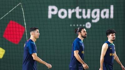 Cristiano Ronaldo, Ruben Neves and Vitinha in action during the team's training session. EPA