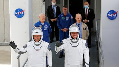 NASA astronauts Douglas Hurley and Robert Behnken head to Pad39A before the launch of a SpaceX Falcon 9 rocket and Crew Dragon spacecraft at the Kennedy Space Center, in Cape Canaveral, Florida, US. Reuters
