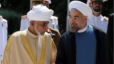 Iranian President Hassan Rouhani (right) greets Oman’s Sultan Qaboos bin Said Al Said at the presidential palace in Tehran on Sunday.