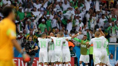 Algeria players celebrate their fourth goal against South Korea on Sunday at the 2014 World Cup. Mohamed Messara / EPA