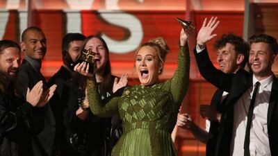 Adele breaks the Grammy for Record of the Year for "Hello" after having it presented to her at the 59th Annual Grammy Awards in Los Angeles, California. Lucy Nicholson / Reuters