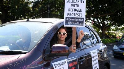 People take part in a May Day car convoy rally, to protest for workers rights during the coronavirus pandemic, in Sydney, Australia. EPA