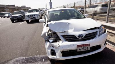 A car involved in an accident sits on the side of Sheikh Zayed Road in Dubai. Christopher Pike / The National