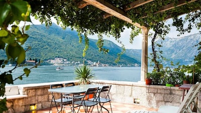 9. Waterfront home in Kotor, Montenegro, with a terrace that offers unobstructed views of two Bay of Kotor islands.
