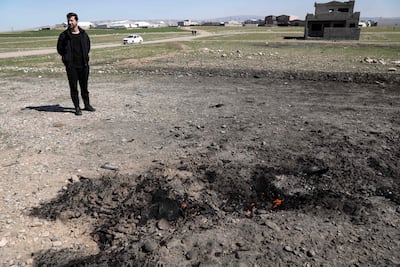A man stands at the site where a drone reportedly aimed at Erbil International Airport crashed outside Erbil, the capital of the autonomous Kurdish region of northern Iraq. AFP