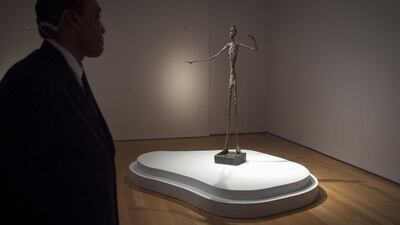 Alberto Giacometti's "L'homme Au Doigt" (Pointing man) sculpture has sold at auction for $141.3 million. Carlo Allegri / Reuters