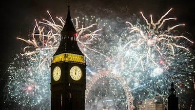 Big Ben stands silhouetted against the New Year fireworks, with the London Eye in the background, on January 1, 2023. PA