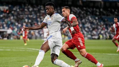 Real Madrid's Vinicius Junior, left, vies for the ball. AP Photo
