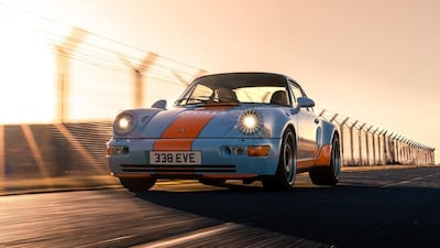 A Porsche 911 replica painted in an orange and blue Gulf racing car livery. Photo: Everrati