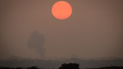 Smoke rises above buildings in Gaza city after an air strike, as seen from the border near Sderot in Israel. Getty Images