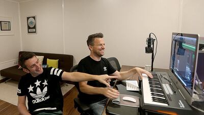 Oliver Wood, left, and Greg Steiner play about in their Dubai studio. They would like to see performance rights royalties collected. Satish Kumar / The National