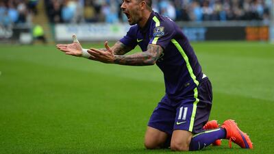 Manchester City defender Aleksandar Kolarov reactsduring Manchester City’s match against Swansea. Gyln Kirk / AFP