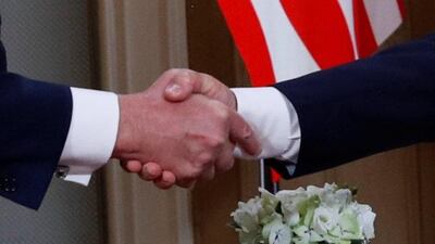 The Trump-Putin handshake. Reuters