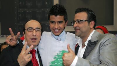 Elias Rahbani, left, with Elie Bitar, centre, and Ziad Boutros after winning Season 5 of the "Super Star" title in Beirut in 2008. 'Super Star' is the Arab version of the US Television talent show "American Idol". AFP