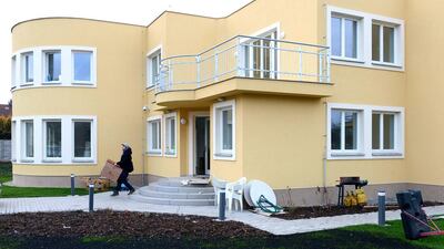 A man carries a box on January 2 while going out of the residence of the Palestinian ambassador, Jamal Al Jamal, in Prague. Michal Cizek / AFP Photo