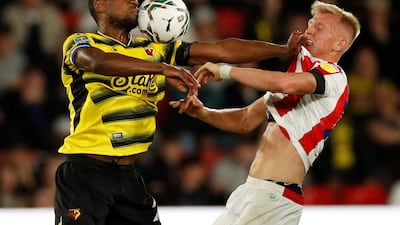 Watford's Christian Kabasele holds off Stoke City player Sam Surridge during a League Cup match at Vicarage Road on Tuesday, September 21. Reuters