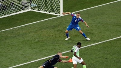 Ahmed Musa, right, dribbles past Iceland goalkeeper Hannes Halldorsson, left, to score Nigeria's second goal. Themba Hadebe / AP Photo