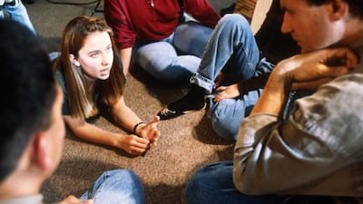Teenagers in a group therapy session. Getty Images