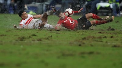Ahly's Ayman Ashraf in action with El Zamalek's Youssef Obama at the Borg El Arab Stadium in Alexandria on March 30, 2019. Reuters