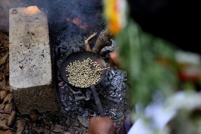 A Saudi farmer roasts Khawlani coffee beans at a coffee farm in Saudi Arabia's south-western region of Jizan, which is known for its red Khawlani beans. AFP