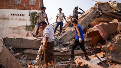 Rescuers work at the site of a collapsed building in the aftermath of a strong earthquake, in Mandalay, Myanmar. Reuters