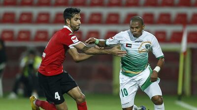 Habib Fardan, left, believes Cosmin Olaroiu is the right man to lead Al Ahli despite the team's struggles this season. Afsl Sham / Al Ittihad