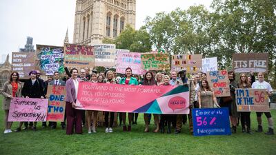 Campaigners outside of the UK Houses of Parliament before delivering the 'Where's Your Head At?' Mental Health Petition to Downing Street. Tom Nicholson / Getty Images