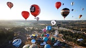 Hot-air balloons are launched at dawn during the Bristol International Balloon Fiesta, in England. AFP