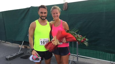 Newly-engaged couple Simone Camposeranio and Giorgia Becker at the finish line of the RAK Half marathon on Friday. Thaer Zriqat / The National