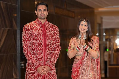 Arjun Tendulkar and Saaniya Chandhok choose auspicious red attire for their wedding ceremony. AFP