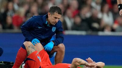 England's John Stones lies on the pitch injured and had to be replaced in the first half. AP
