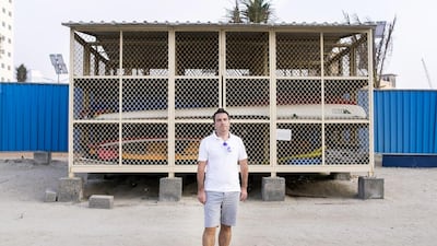 Chris Spong stands in front of what used to be his surf gear locker on Nakheel’s private Palm Jumeirah Beach. Reem Mohammed / The National