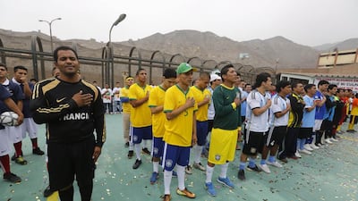 Prisoners participate in the opening ceremony of their own version of the 2014 World Cup at the Castro-Castro prison in Lima on Monday. Mariana Bazo / Reuters / June 2, 2014