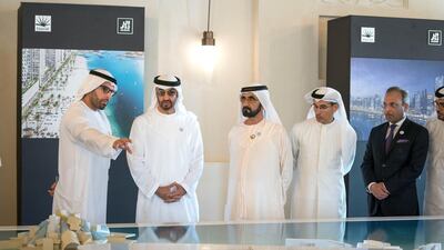 Sheikh Mohammed bin Zayed and Sheikh Mohamed bin Rashid view a plan of Saadiyat Island before the signing of a joint venture agreement between Aldar and Emaar. Seen with Mohamed Khalifa Al Mubarak, Chairman of the Department of Culture and Tourism and Abu Dhabi Executive Council Member, left, and Mohamed Al Abbar, Founder and Chairman of Emaar Properties. Mohammed Al Hammadi / Crown Prince Court - Abu Dhabi