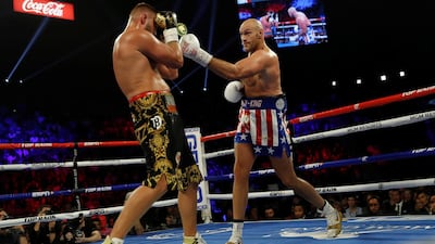 Tyson Fury and Tom Schwarz in action. REUTERS