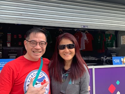 Paul Liew, pictured with his wife, said he waited for four hours in an online queue for an Argentina v Croatia ticket. Ali Al Shouk / The National