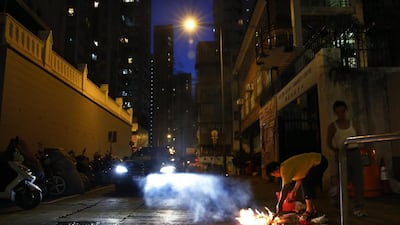 The shows are accompanied by extravagant feasts of grilled pork, broiled chicken, rice and fruit. The offerings are made in the hope that the spirits will help them find good jobs, earn good grades or even with the lottery.