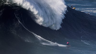 Joao Chianca of Brazil rides a wave during a WSL big wave challenge surfing session in Nazare, Portugal. AFP