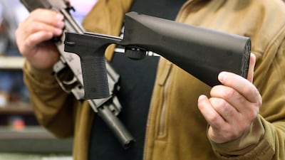 A bump stock device is shown next to a AK-47 semi-automatic rifle at a gun store in Salt Lake City, Utah. Getty Images North America / AFP