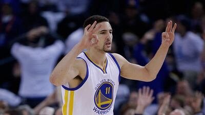 Klay Thompson of the Golden State Warriors reacts after making a three-point shot against the Oklahoma City Thunder in his team's win the NBA on Monday night. Ezra Shaw / Getty Images / AFP / January 5, 2015