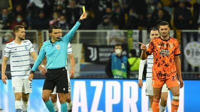 Juventus defender Merih Demiral is shown a yellow card. AFP