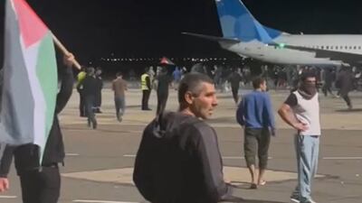 Airline employees rushed passengers back inside planes as the crowds approached the aircraft