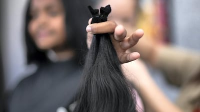 More than 100 people had their hair cut on Tuesday at the Consulate General of India in Dubai. Reem Mohammed / The National