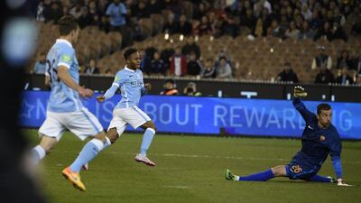Manchester City's Raheem Sterling beats AS Roma keeper Morgan De Sanctis to score City's opener on Tuesday in their International Champions Cup pre-season win. Mal Fairclough / AFP