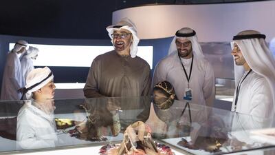 Sheikh Mohammed bin Zayed at an exhibition on the opening day of the festival. Seen with him are Mohammed Khalifa Al Mubarak, Chief Executive of Aldar Properties, and Sheikh Zayed bin Mohammed. Ryan Carter / Crown Prince Court - Abu Dhabi
