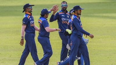 Krunal Pandya, centre, celebrates with teammates after he dismissed Sri Lanka's Dhananjaya de Silva.